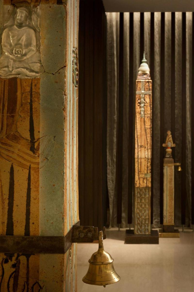 a room with a altar with a bell and other items at The Westin Gurgaon, New Delhi in Gurgaon