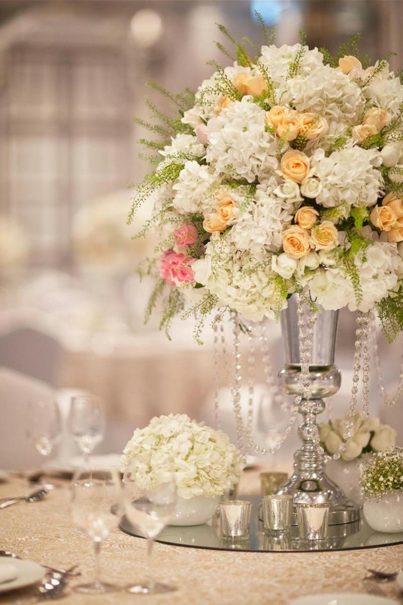 a vase filled with flowers on top of a table at The Ritz-Carlton, Pune in Pune