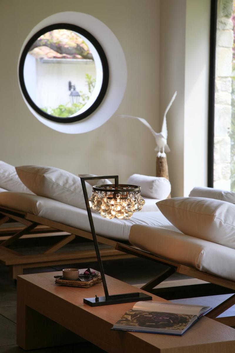 Un ou plusieurs lits dans un hébergement de l'établissement Le Clos Saint-Martin Hôtel & Spa