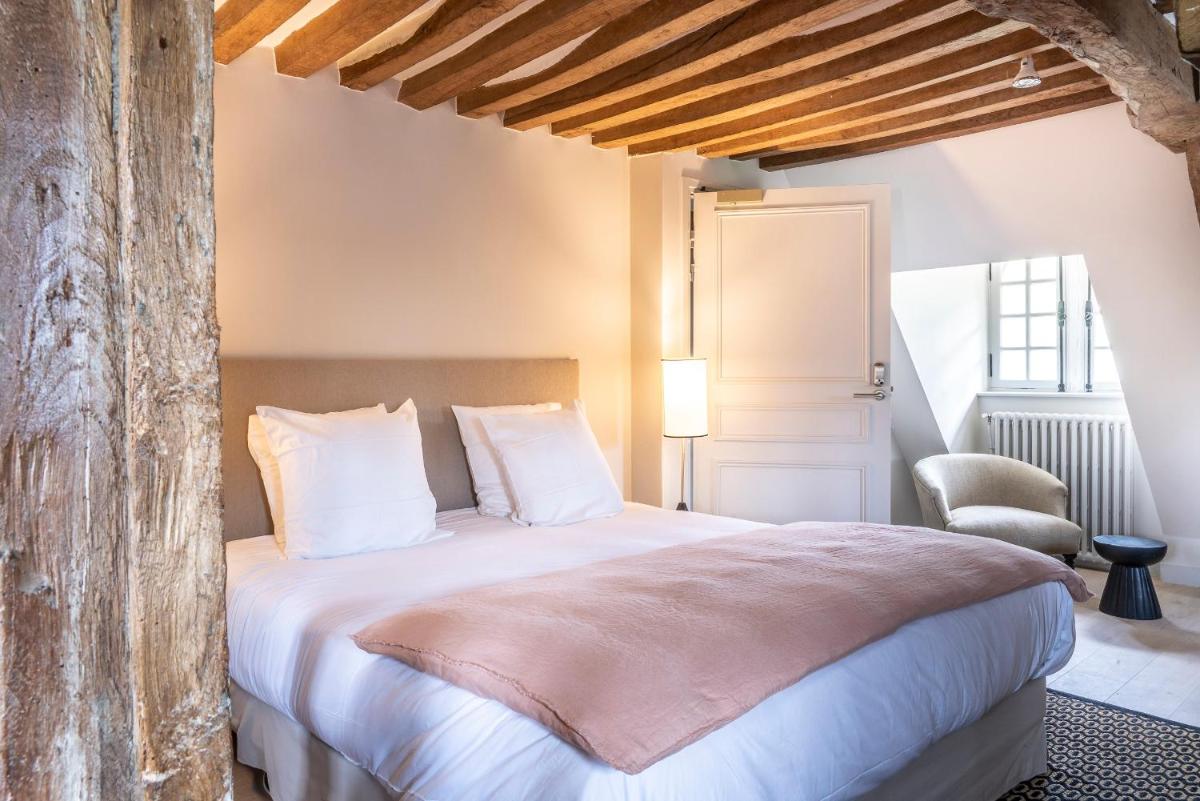 Un ou plusieurs lits dans un hébergement de l'établissement Les Manoirs des Portes de Deauville - Small Luxury Hotel Of The World