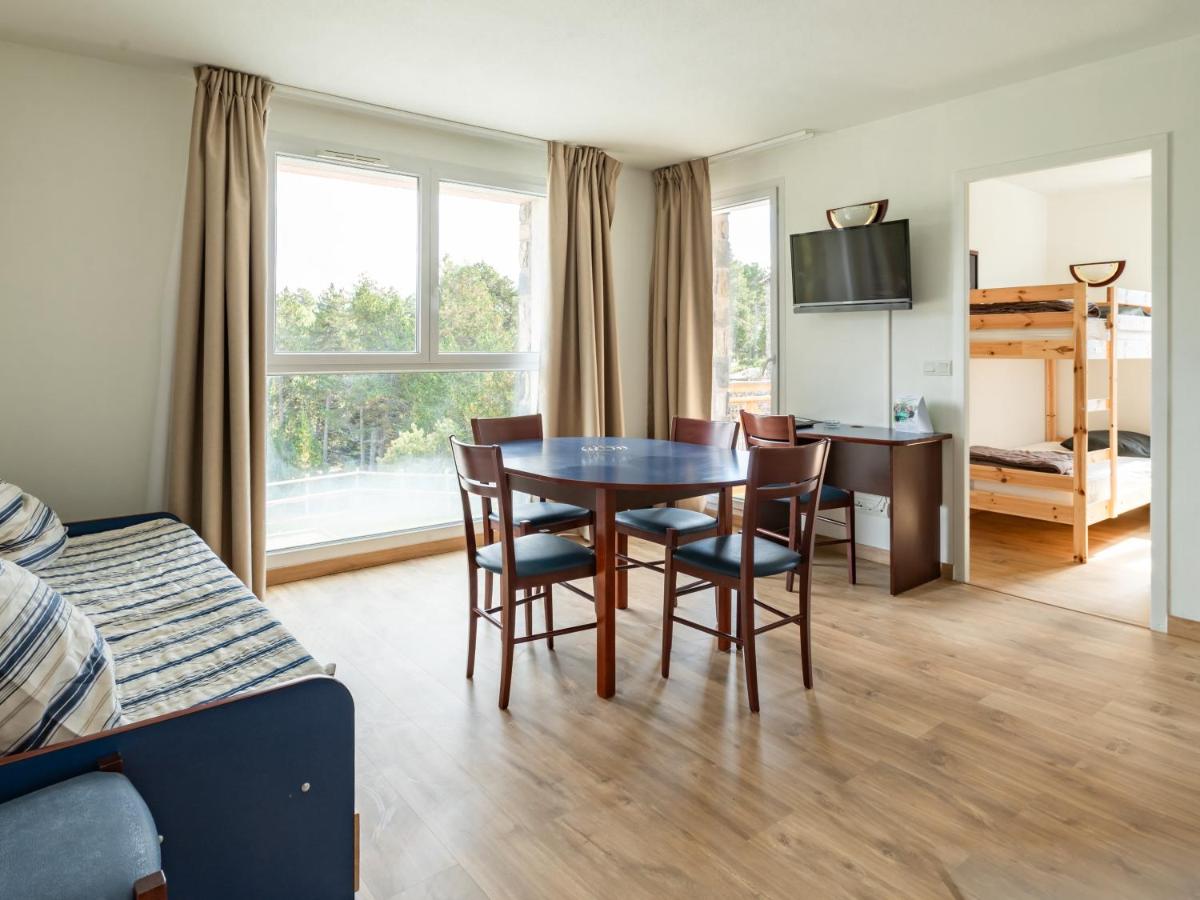 Cuisine ou kitchenette dans l'établissement Vacancéole - Appart'Vacances Pyrénées 2000