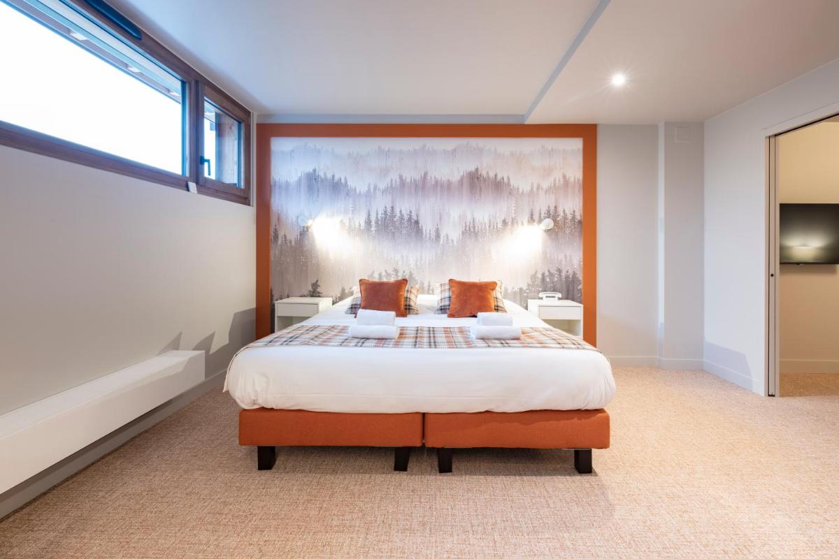 Un ou plusieurs lits dans un hébergement de l'établissement Hotel Le Bois Joli