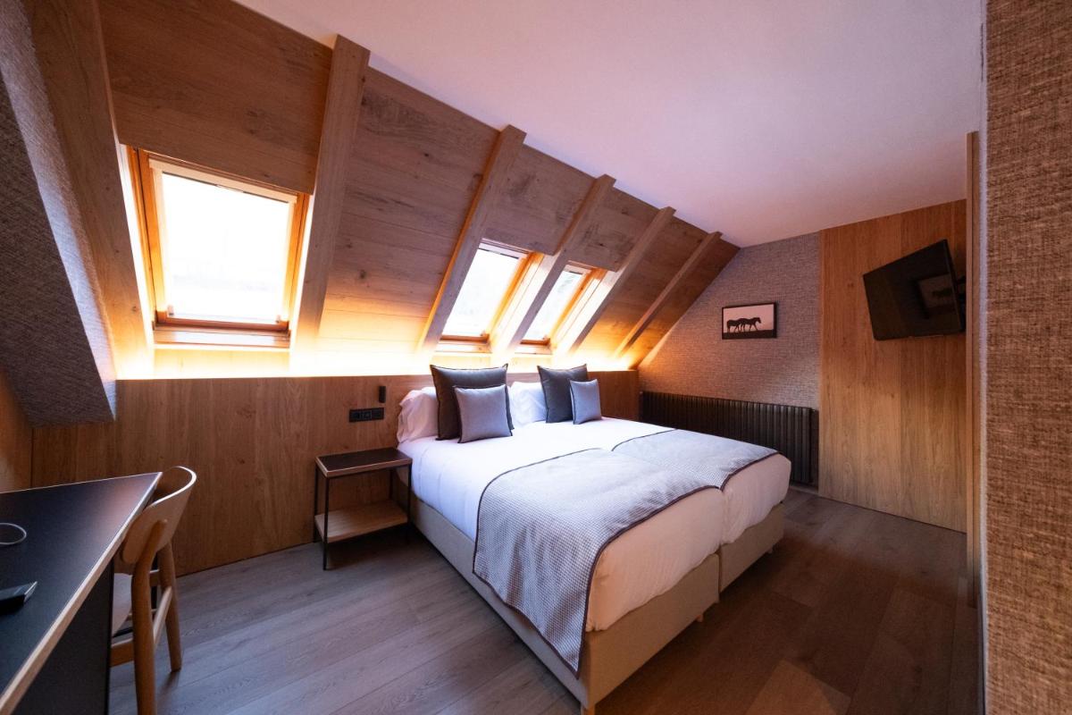 Cama o camas de una habitación en Hotel Petit Lacreu