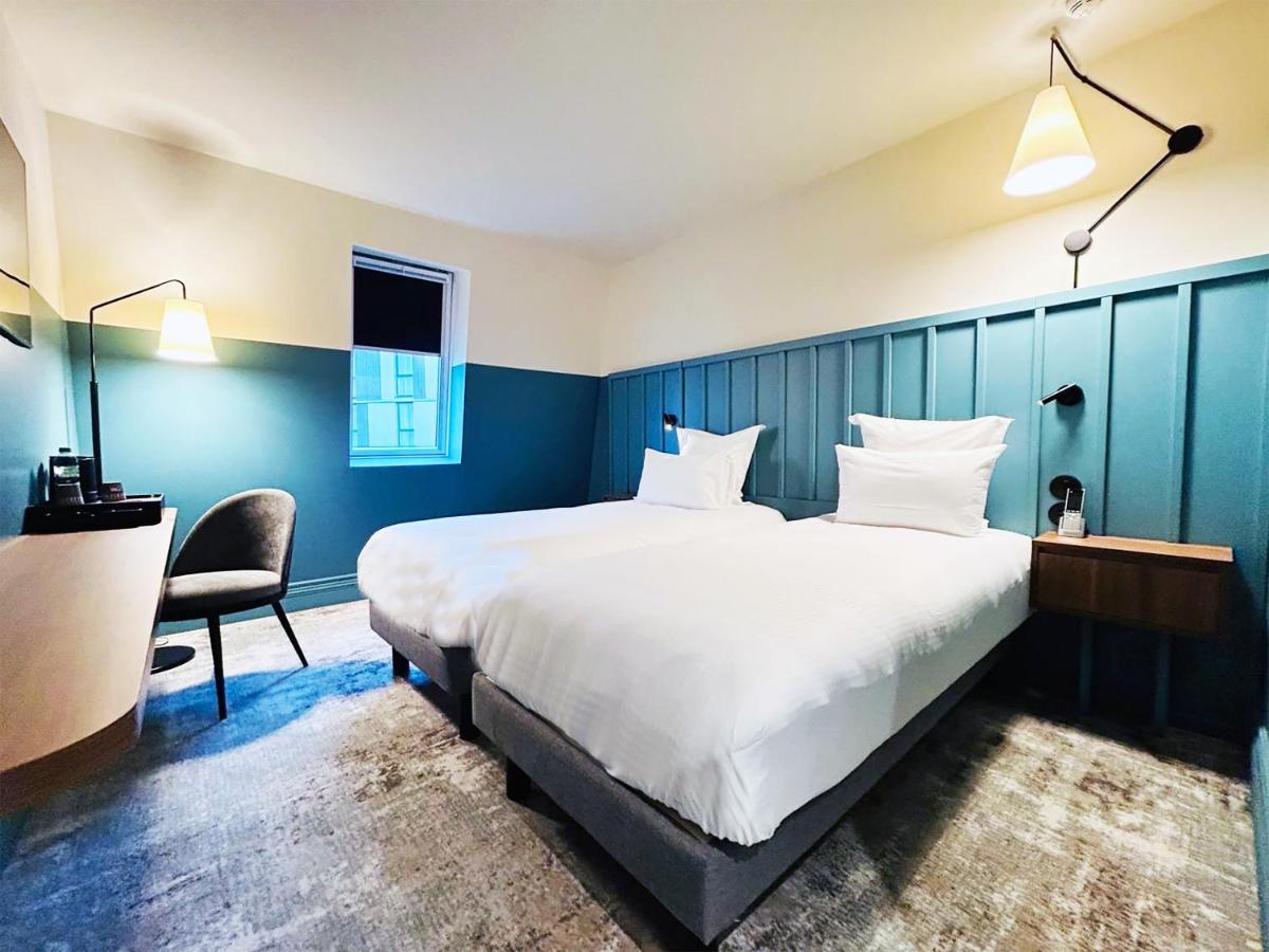 Un ou plusieurs lits dans un hébergement de l'établissement Kyriad Prestige Compiègne Hotel & Spa