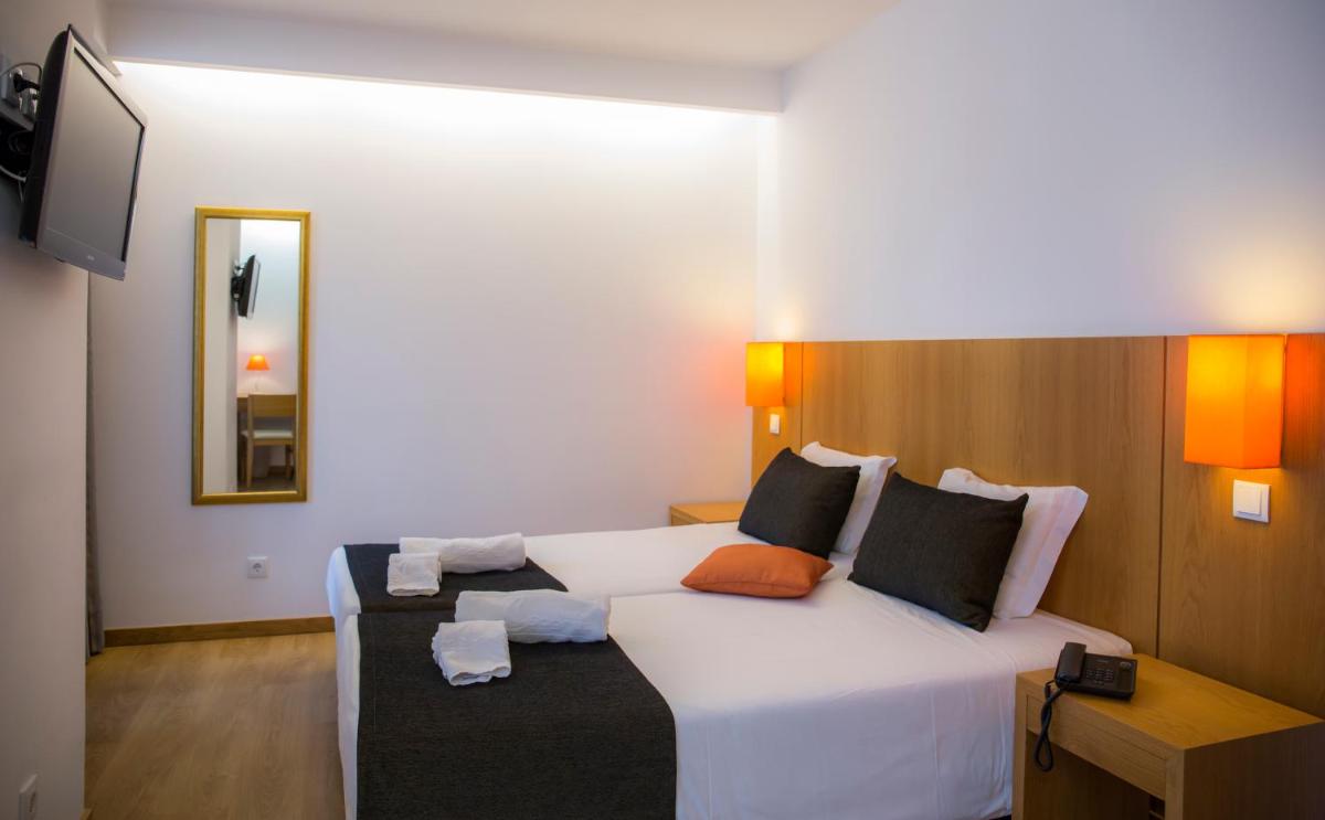 Uma cama ou camas num quarto em Hotel Mira Sagres