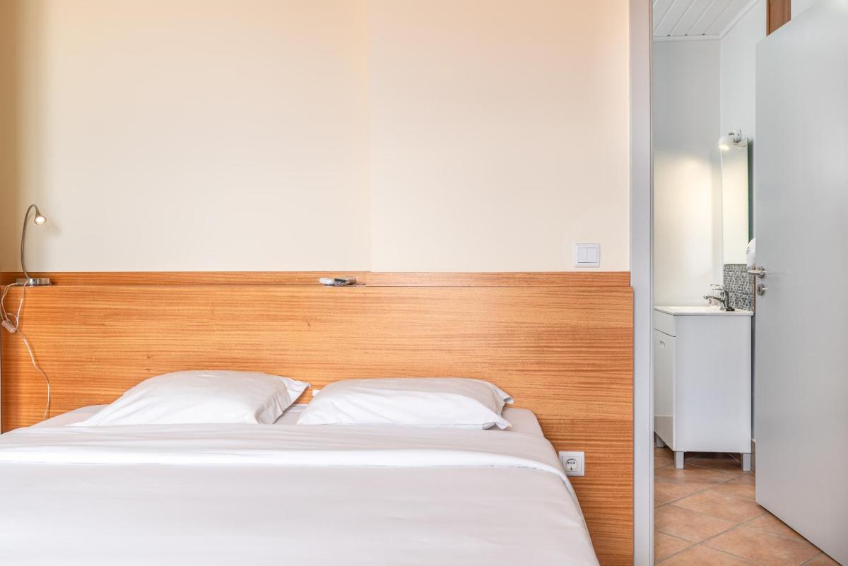 Uma cama ou camas num quarto em TarmarPlace