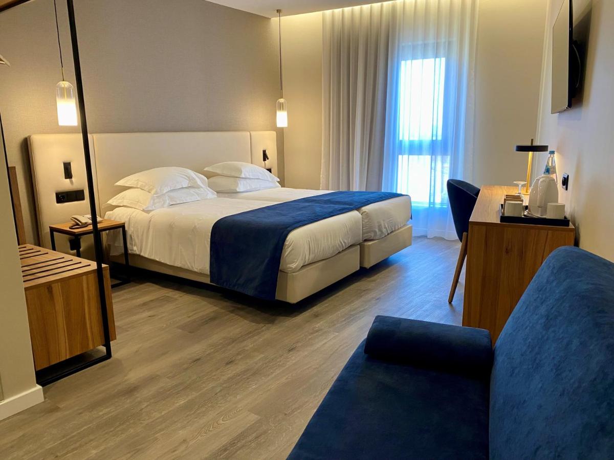 Uma cama ou camas num quarto em AP Sines - Costa Alentejana