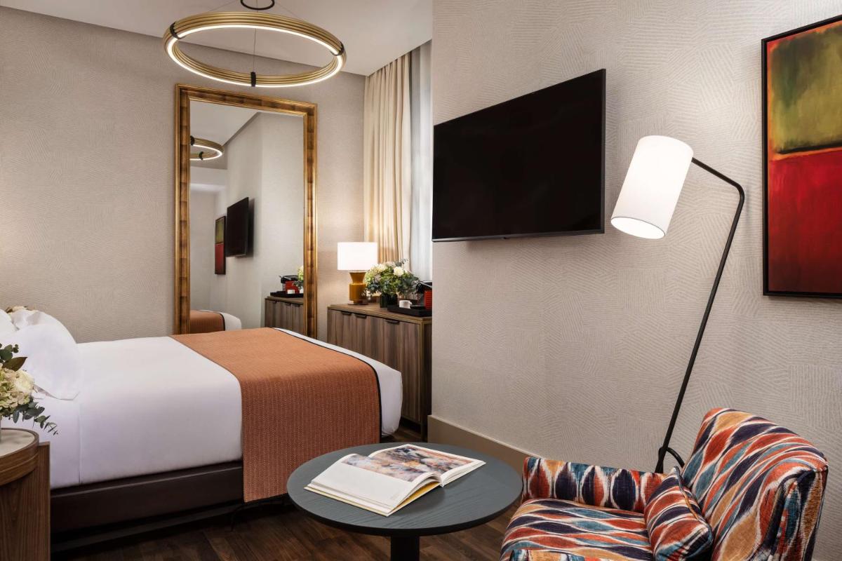 Cama o camas de una habitación en NH Collection Madrid Paseo del Prado