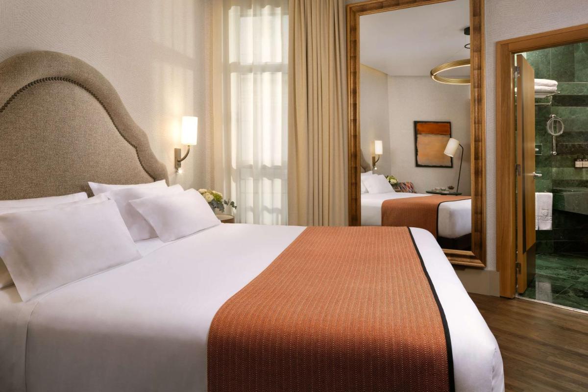 Cama o camas de una habitación en NH Collection Madrid Paseo del Prado