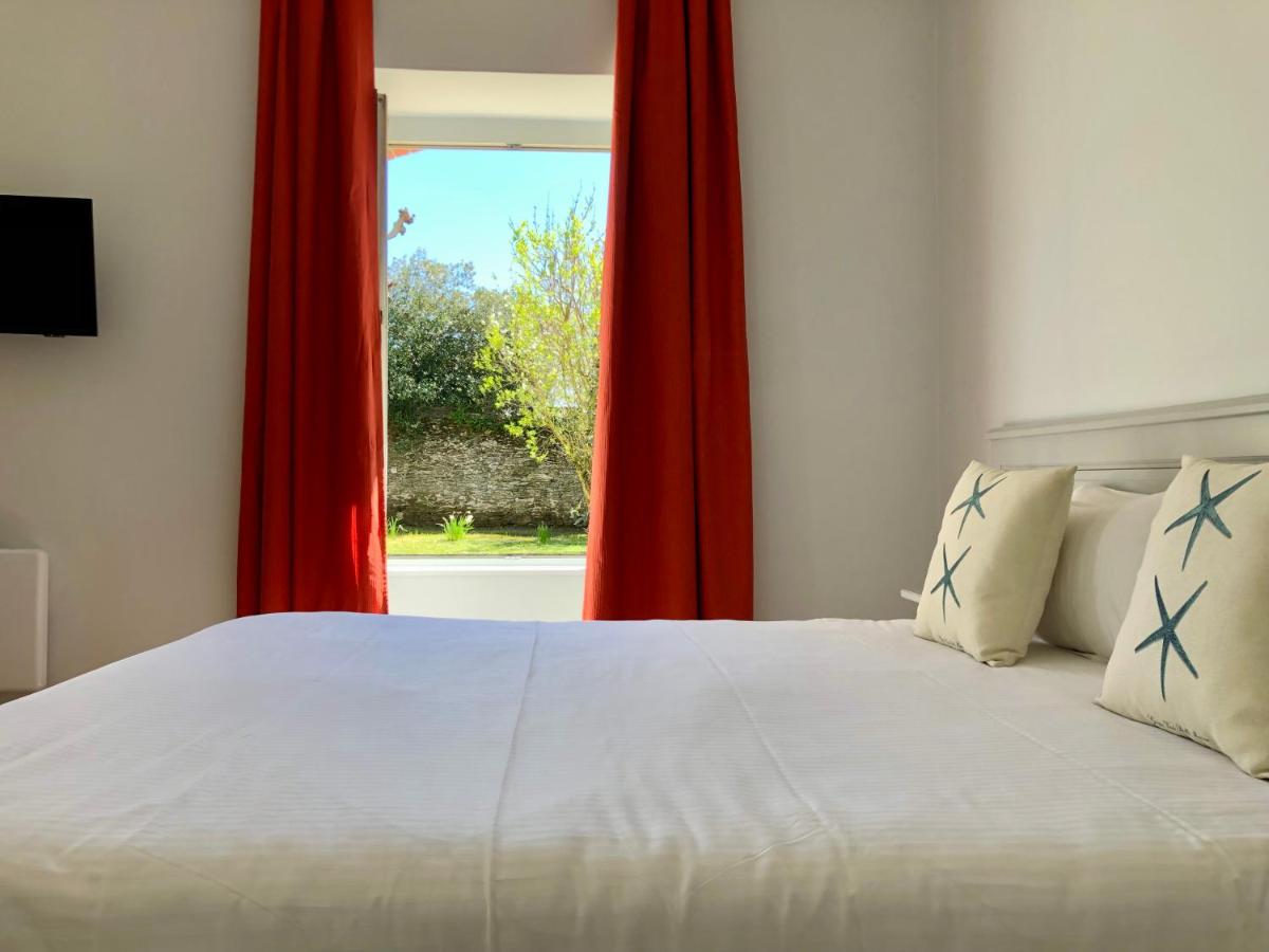 Un ou plusieurs lits dans un hébergement de l'établissement Eco-Domaine La Fontaine - RESIDENCE-SPA - Plage de la Fontaine aux Bretons