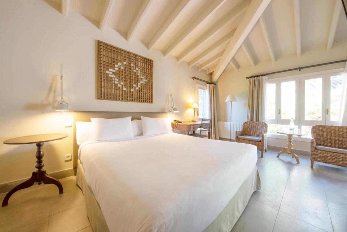 Cama o camas de una habitación en Hotel Huerto del Cura