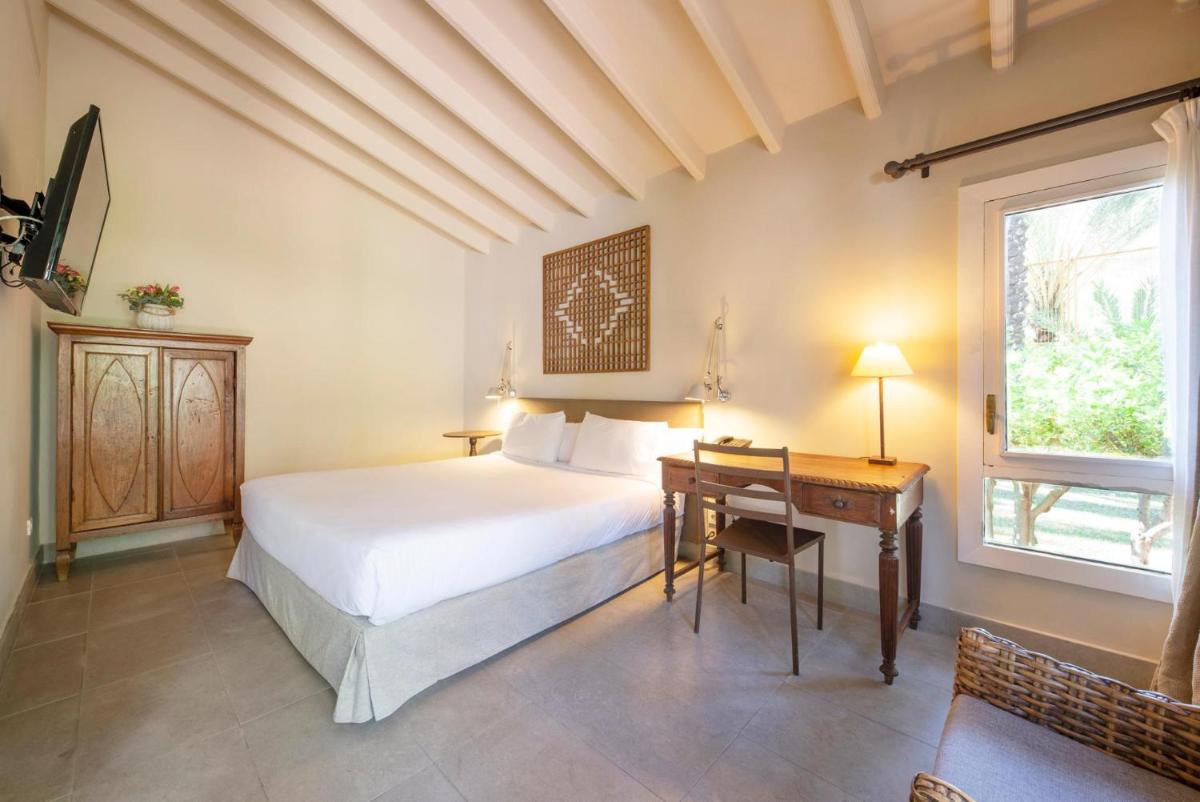 Cama o camas de una habitación en Hotel Huerto del Cura
