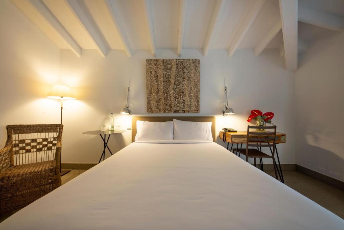 Cama o camas de una habitación en Hotel Huerto del Cura