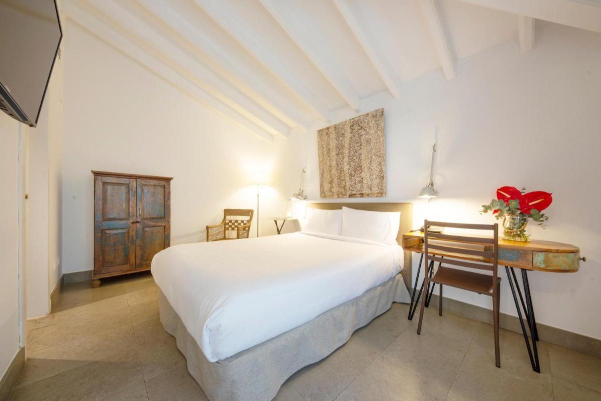 Cama o camas de una habitación en Hotel Huerto del Cura