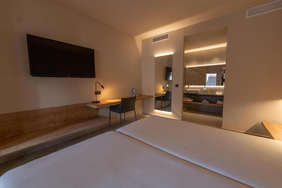 Cama o camas de una habitación en Hotel Huerto del Cura