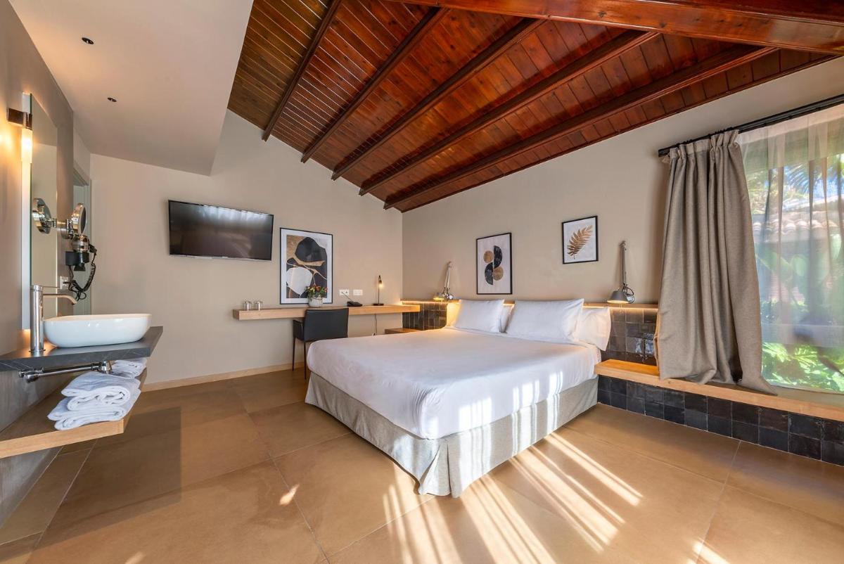 Cama o camas de una habitación en Hotel Huerto del Cura