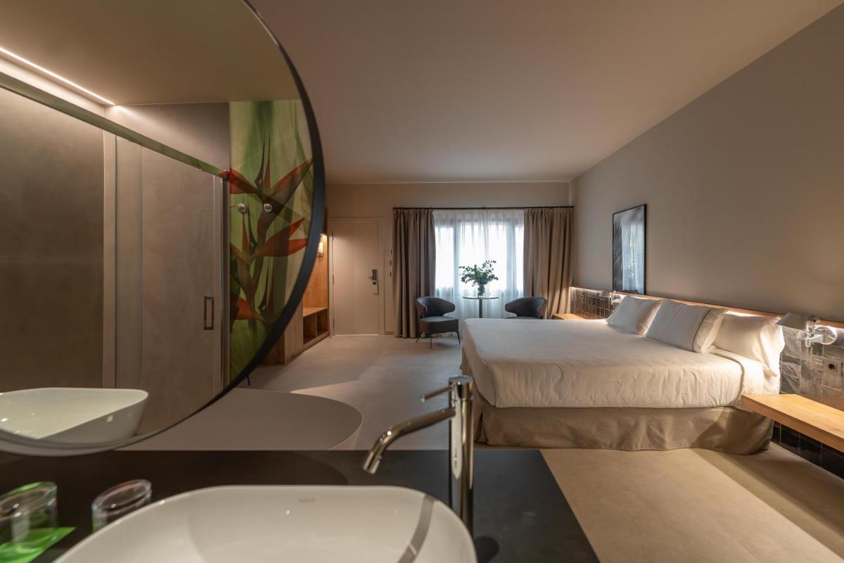 Cama o camas de una habitación en Hotel Huerto del Cura