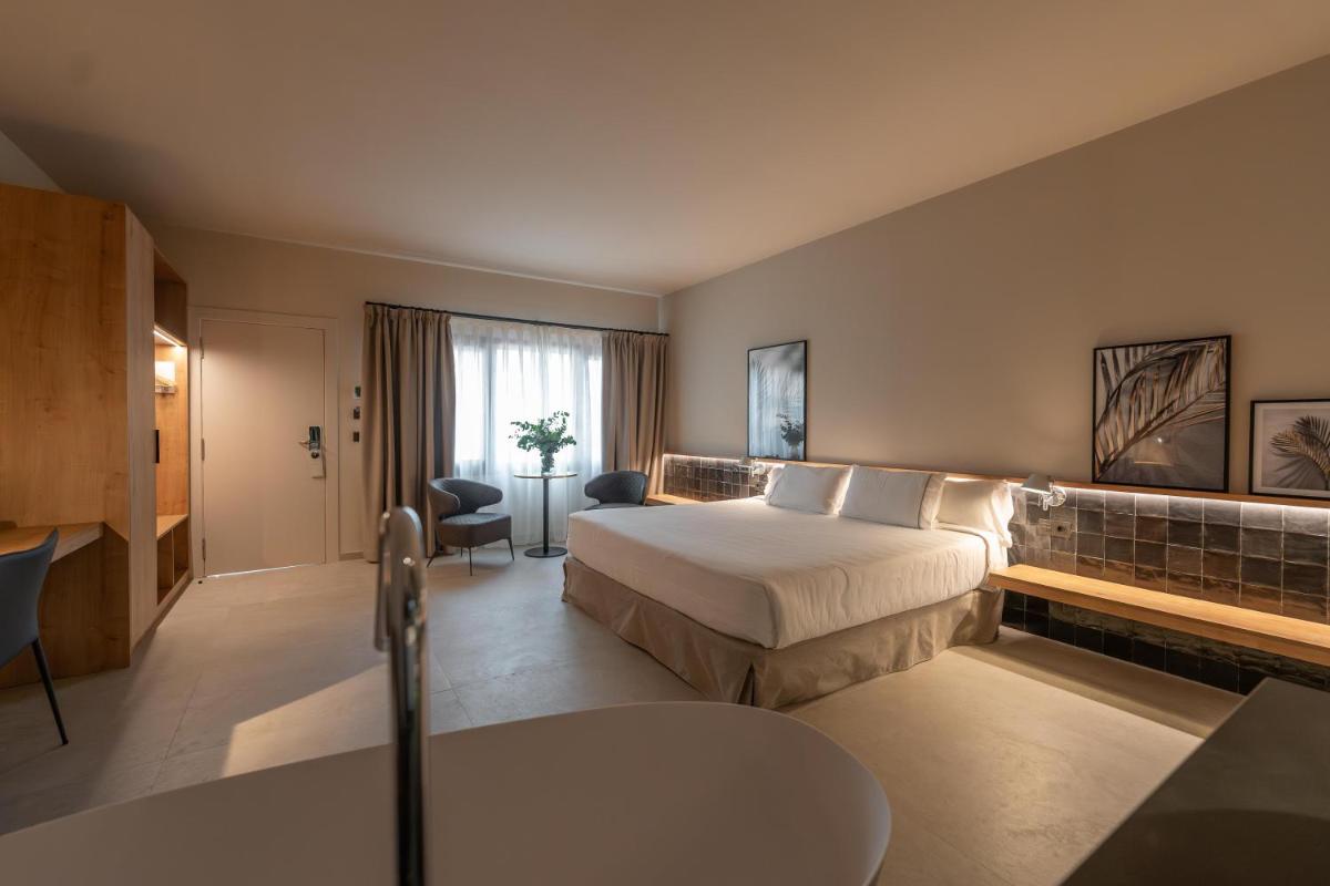 Cama o camas de una habitación en Hotel Huerto del Cura