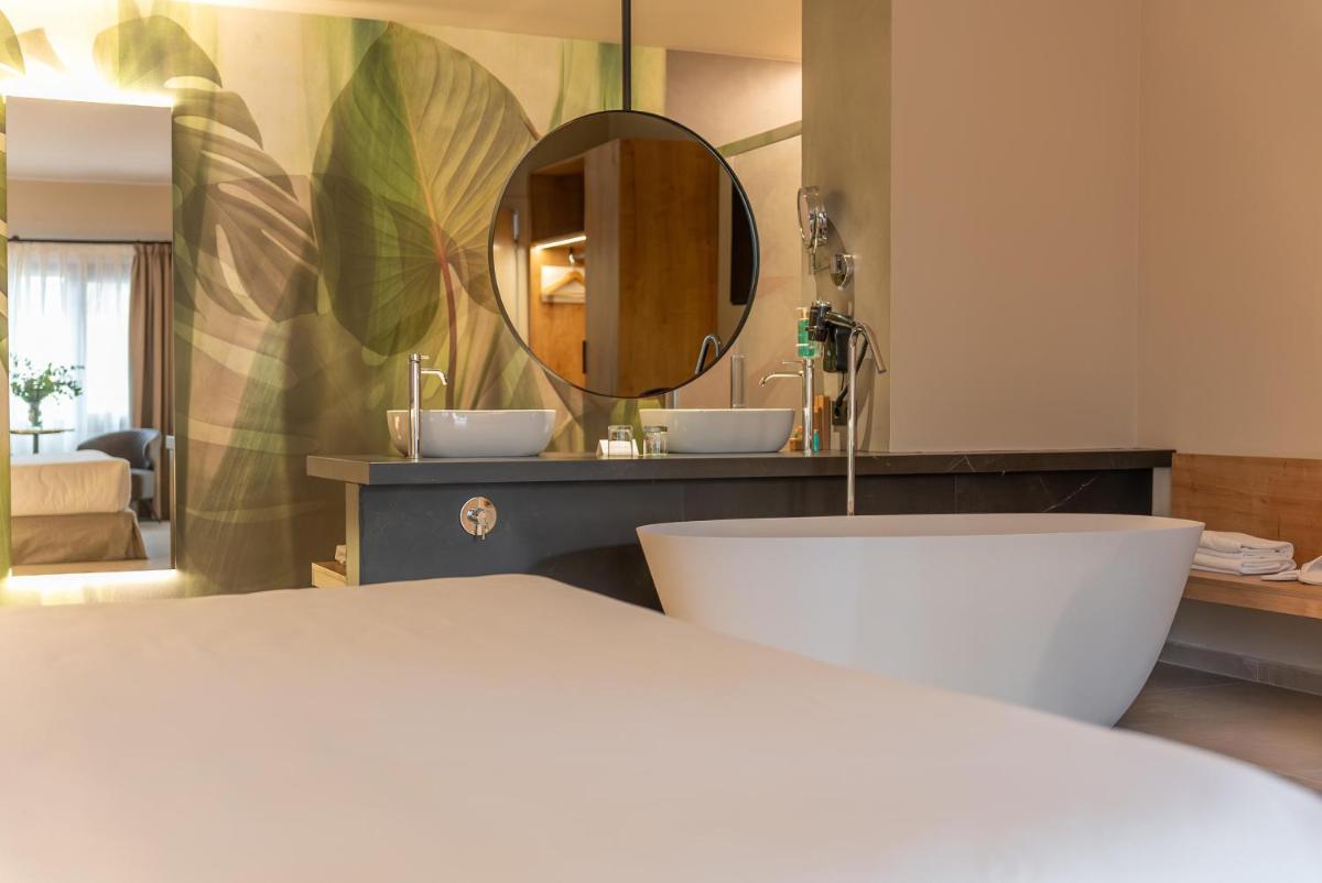 Cama o camas de una habitación en Hotel Huerto del Cura