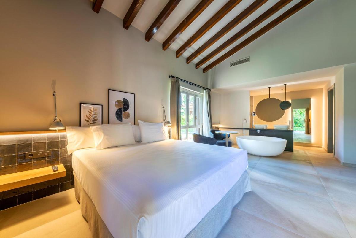 Cama o camas de una habitación en Hotel Huerto del Cura
