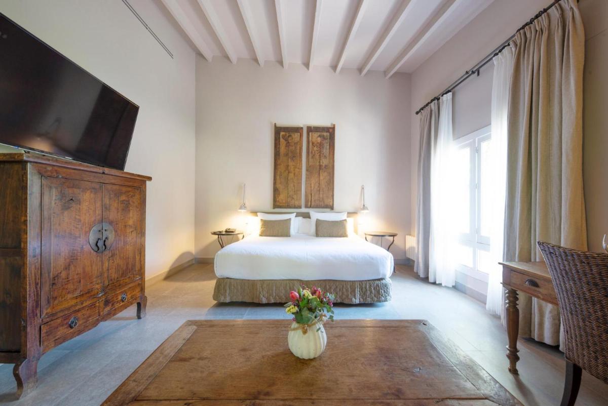 Cama o camas de una habitación en Hotel Huerto del Cura