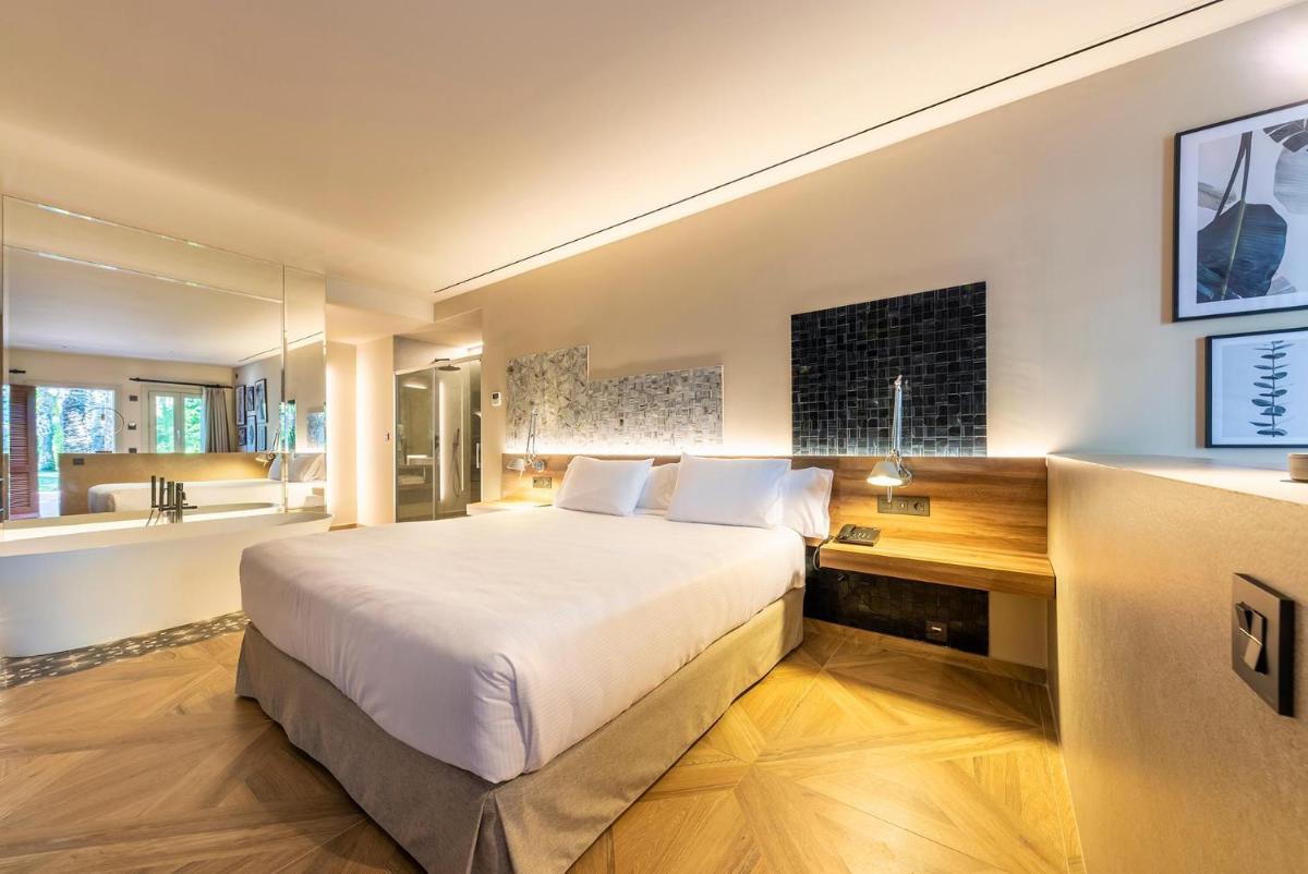 Cama o camas de una habitación en Hotel Huerto del Cura