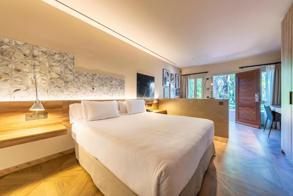 Cama o camas de una habitación en Hotel Huerto del Cura