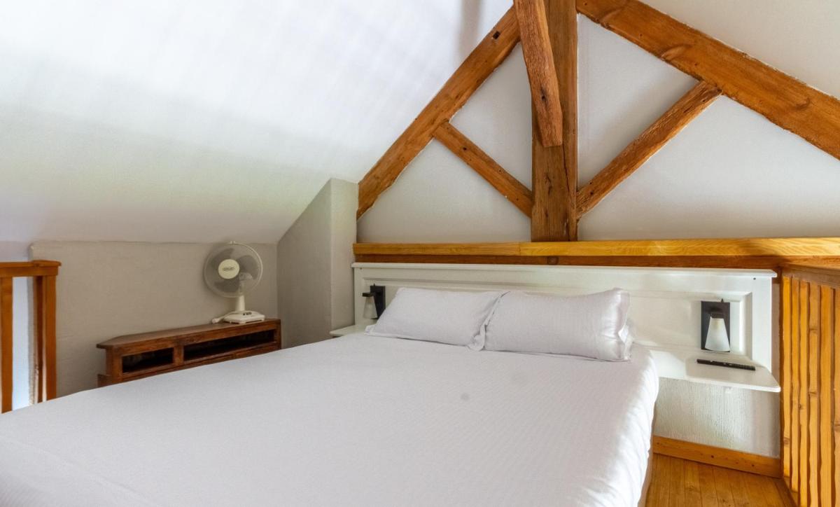 Un ou plusieurs lits dans un hébergement de l'établissement Eco-Domaine La Fontaine - RESIDENCE-SPA - Plage de la Fontaine aux Bretons