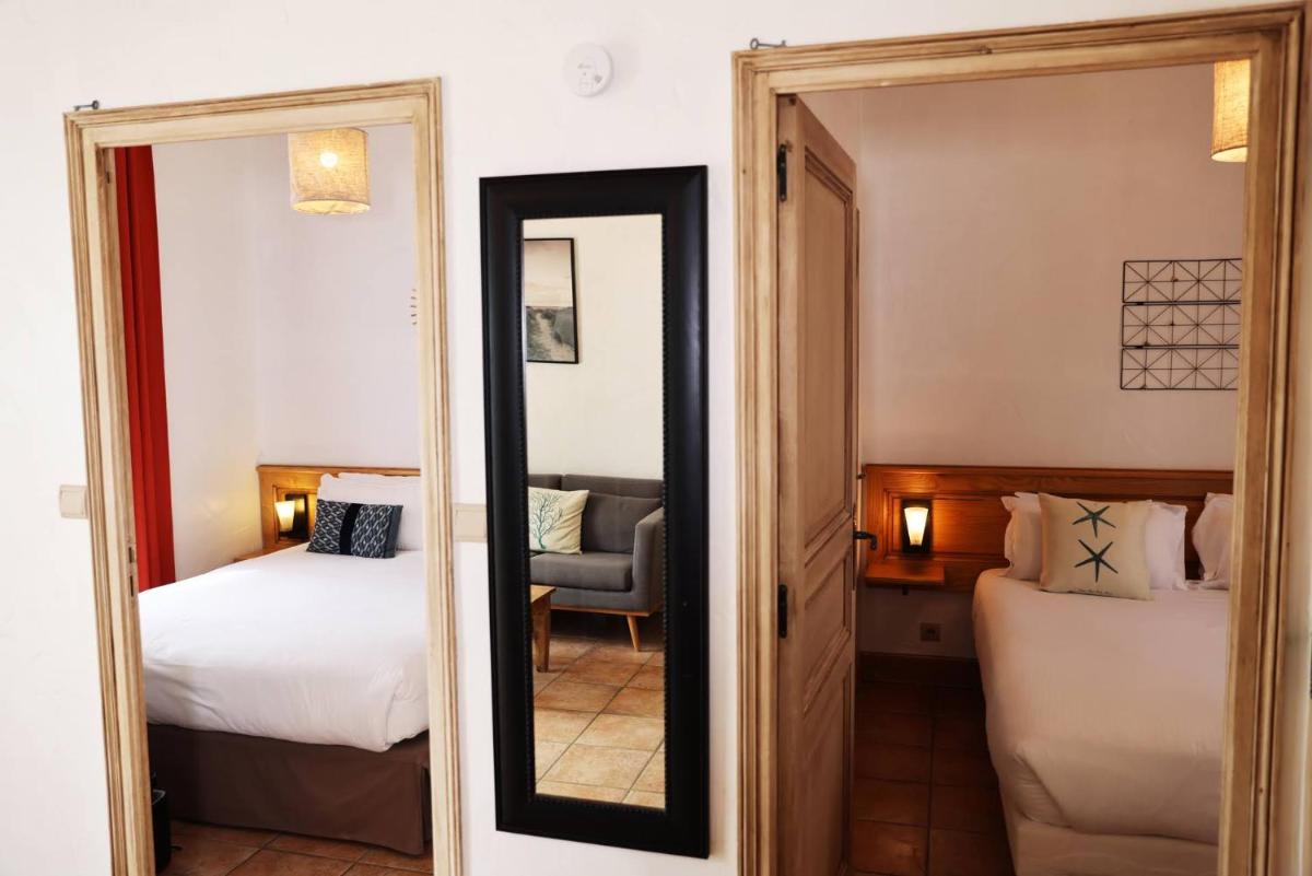 Un ou plusieurs lits dans un hébergement de l'établissement Eco-Domaine La Fontaine - RESIDENCE-SPA - Plage de la Fontaine aux Bretons