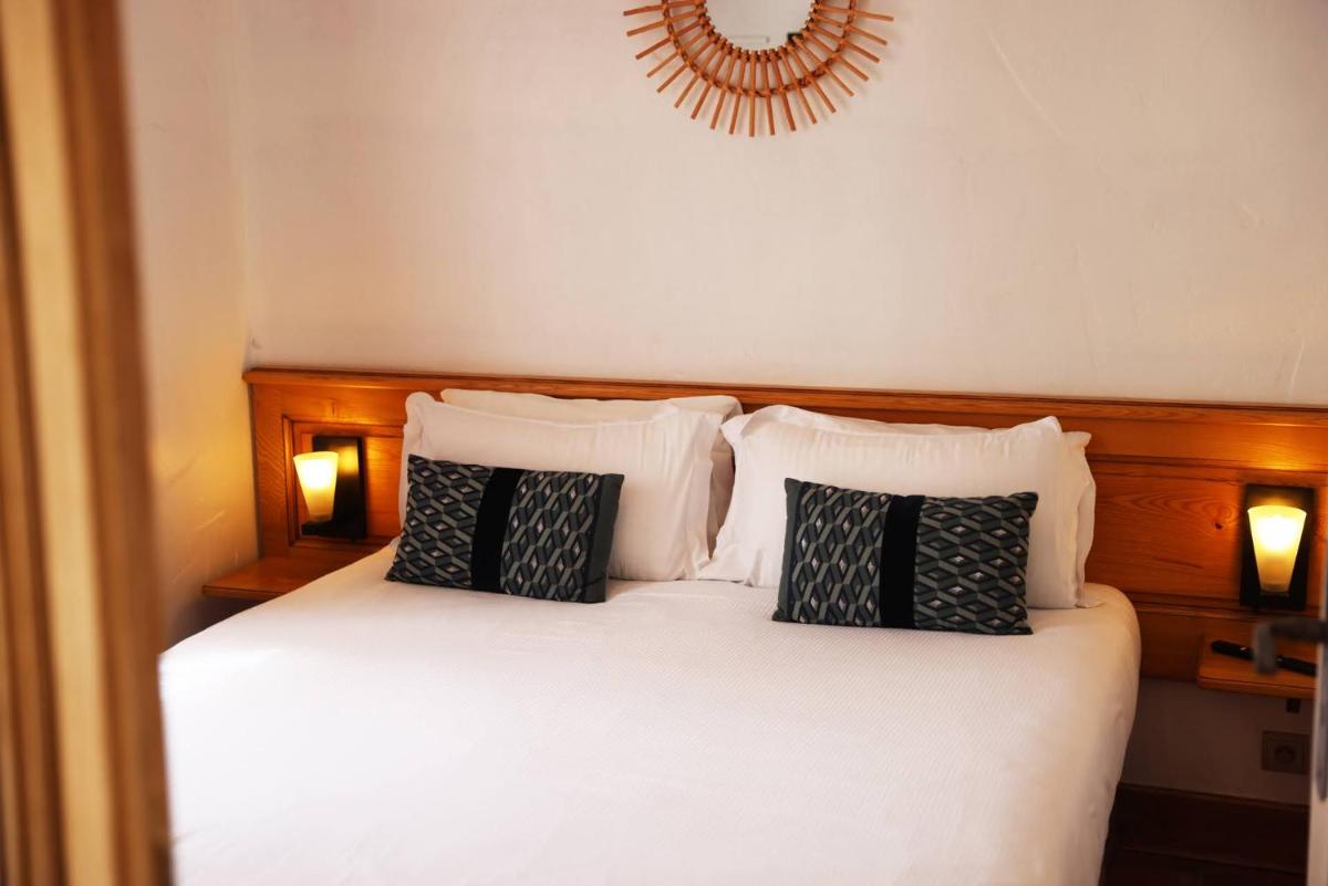 Un ou plusieurs lits dans un hébergement de l'établissement Eco-Domaine La Fontaine - RESIDENCE-SPA - Plage de la Fontaine aux Bretons