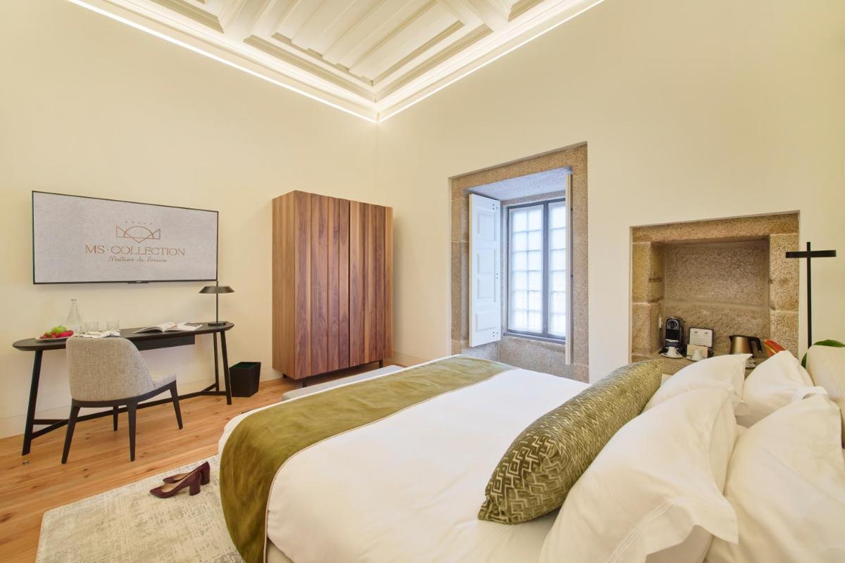 Uma cama ou camas num quarto em MS Collection Arouca - Mosteiro de Arouca