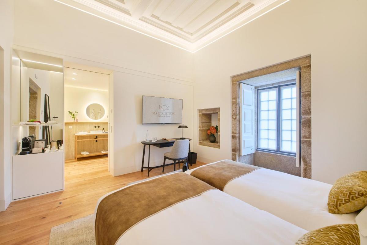 Uma cama ou camas num quarto em MS Collection Arouca - Mosteiro de Arouca