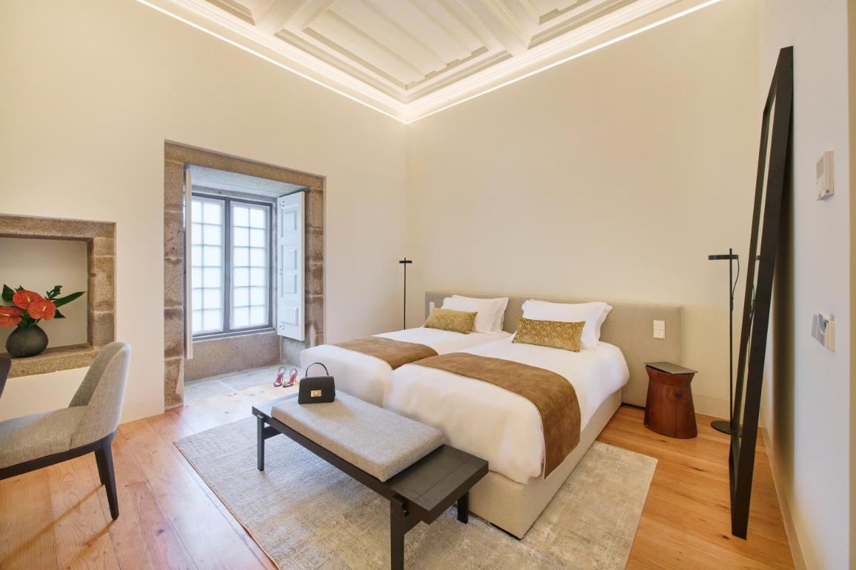 Uma cama ou camas num quarto em MS Collection Arouca - Mosteiro de Arouca