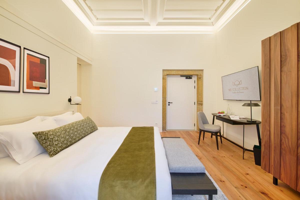Uma cama ou camas num quarto em MS Collection Arouca - Mosteiro de Arouca