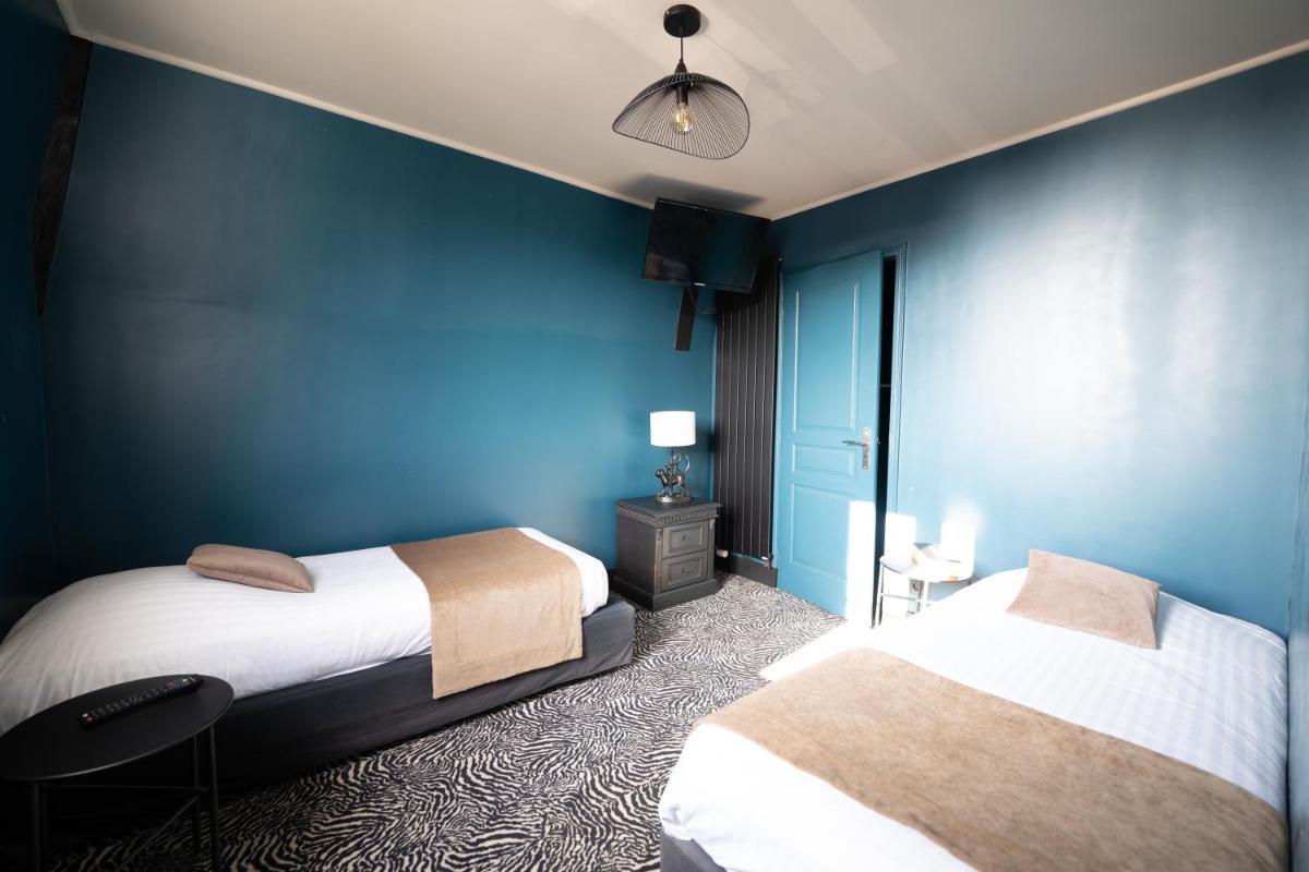 Un ou plusieurs lits dans un hébergement de l'établissement La villa 10 HÔTEL SPA