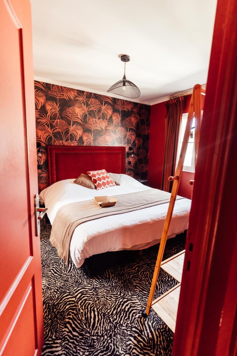 Un ou plusieurs lits dans un hébergement de l'établissement La villa 10 HÔTEL SPA