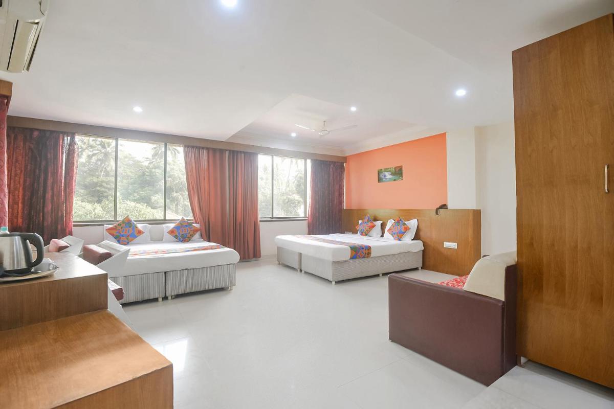 Collection O Caring Holiday Inn - Housity