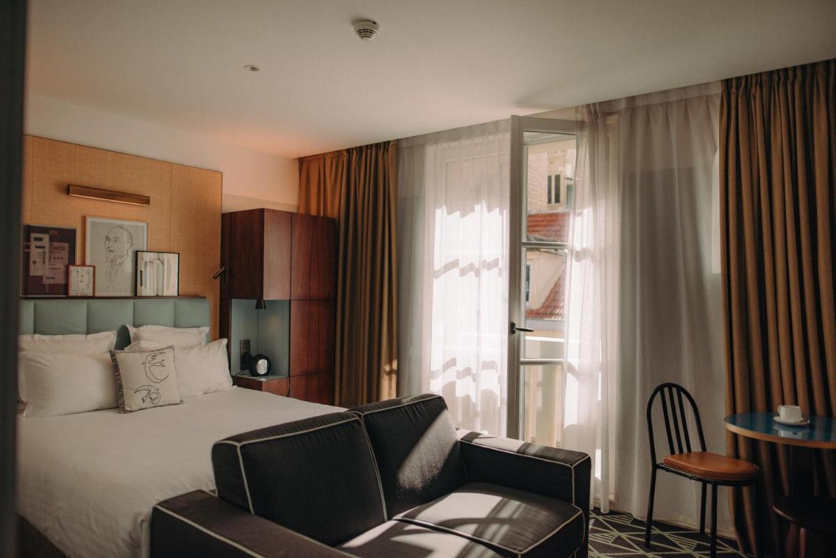 Un ou plusieurs lits dans un hébergement de l'établissement Hotel Eiffel Blomet