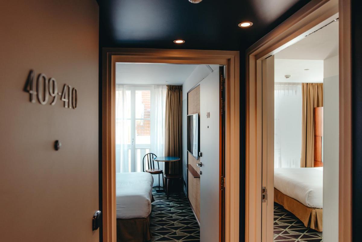 Un ou plusieurs lits dans un hébergement de l'établissement Hotel Eiffel Blomet