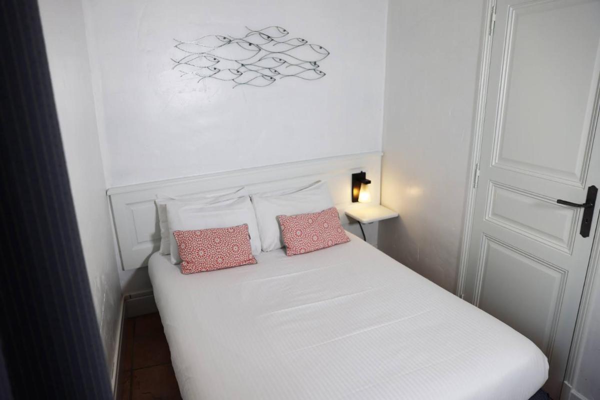 Un ou plusieurs lits dans un hébergement de l'établissement Eco-Domaine La Fontaine - RESIDENCE-SPA - Plage de la Fontaine aux Bretons
