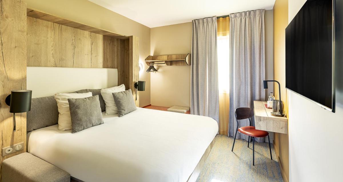 Un ou plusieurs lits dans un hébergement de l'établissement Best Western Coeur de Maurienne Hotel Restaurant & Spa