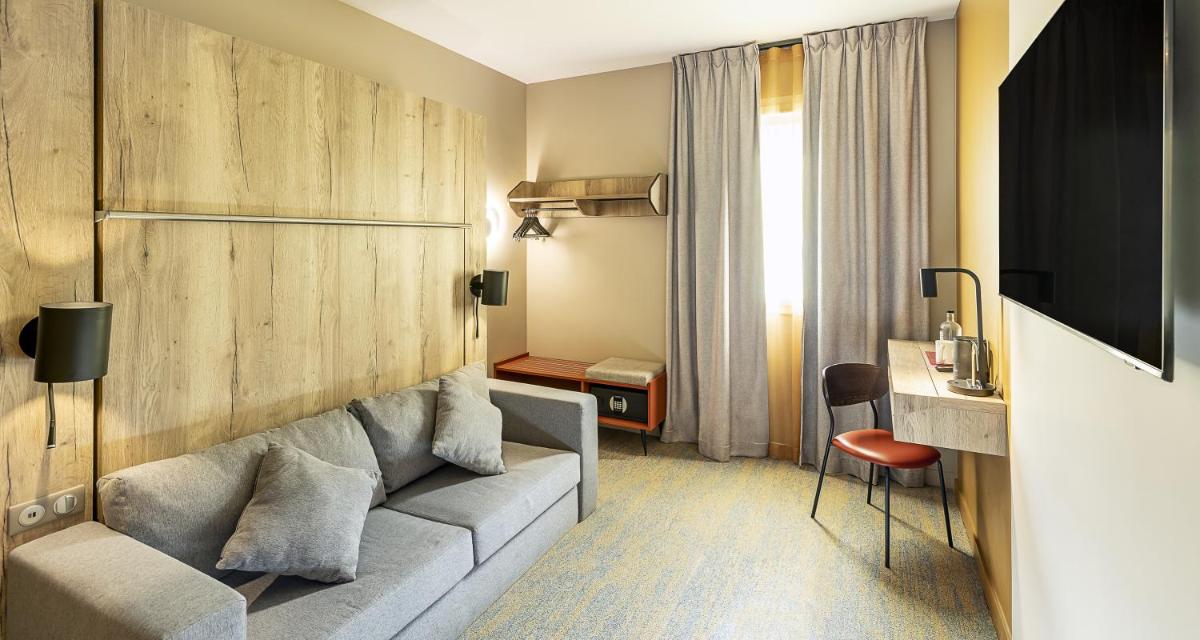 Coin salon dans l'établissement Best Western Coeur de Maurienne Hotel Restaurant & Spa