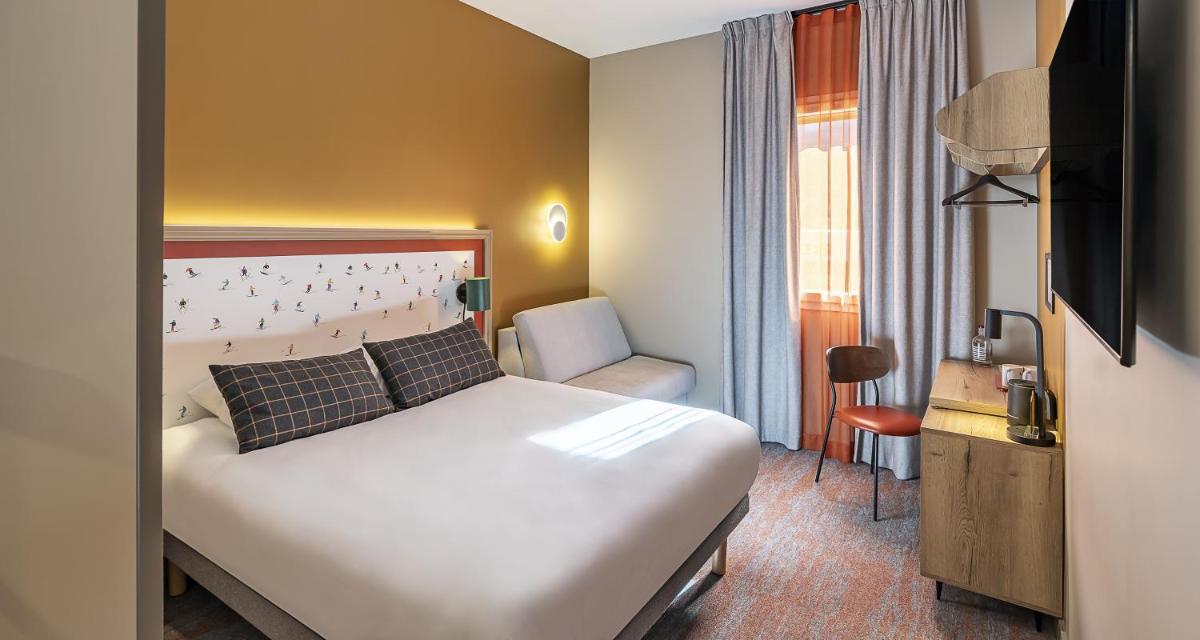 Un ou plusieurs lits dans un hébergement de l'établissement Best Western Coeur de Maurienne Hotel Restaurant & Spa