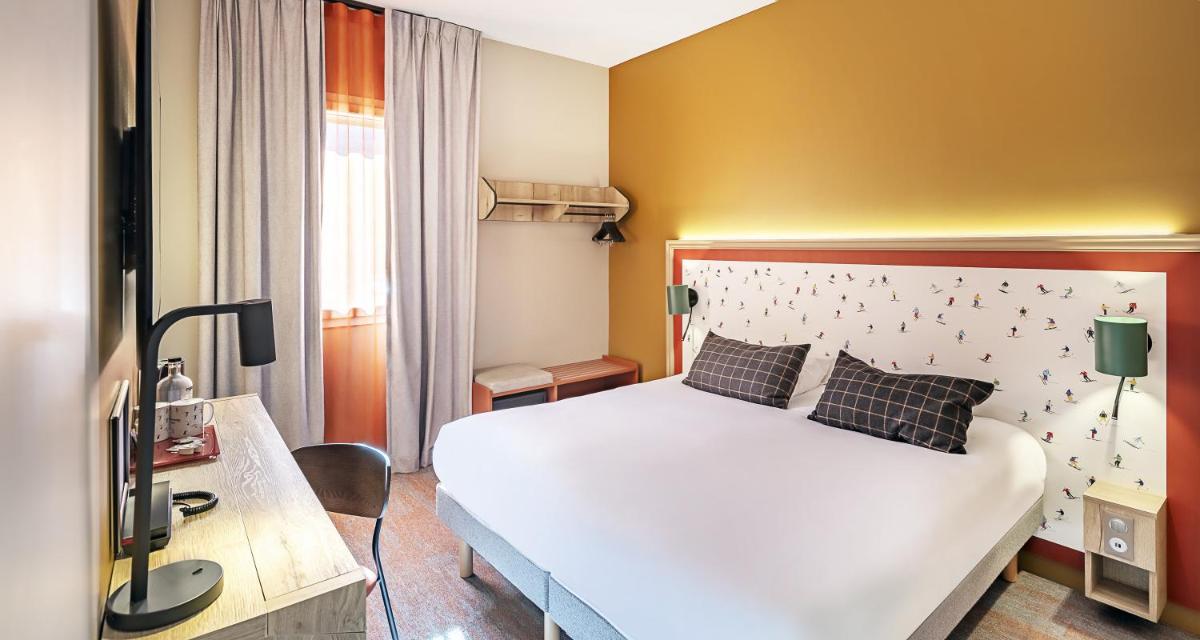 Un ou plusieurs lits dans un hébergement de l'établissement Best Western Coeur de Maurienne Hotel Restaurant & Spa