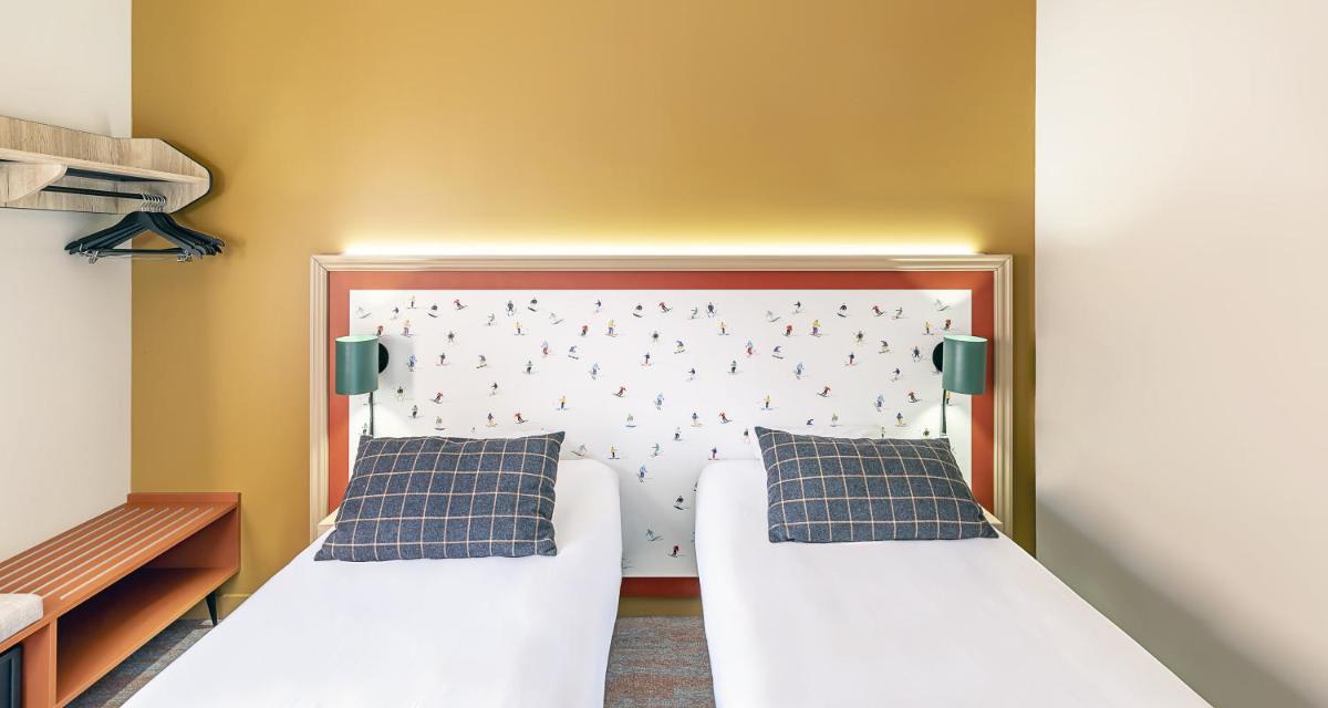 Un ou plusieurs lits dans un hébergement de l'établissement Best Western Coeur de Maurienne Hotel Restaurant & Spa