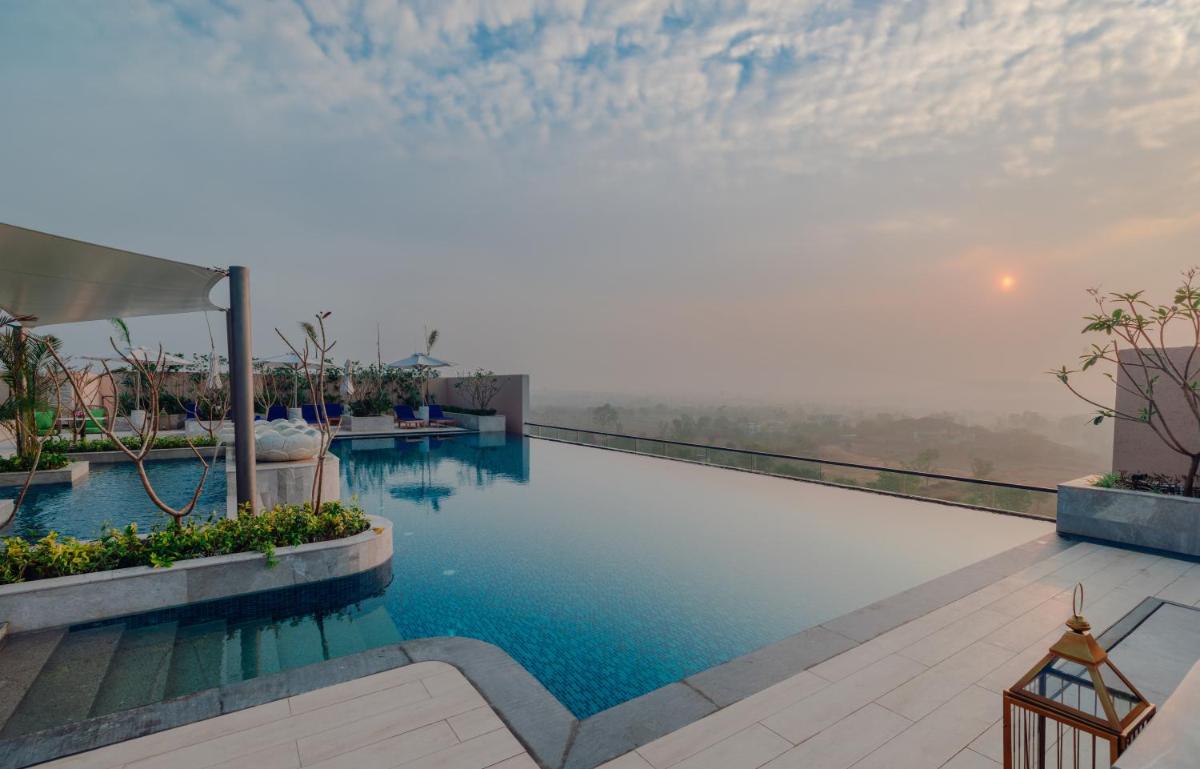 a swimming pool with a view of the sky at Taj Amer, Jaipur in Jaipur