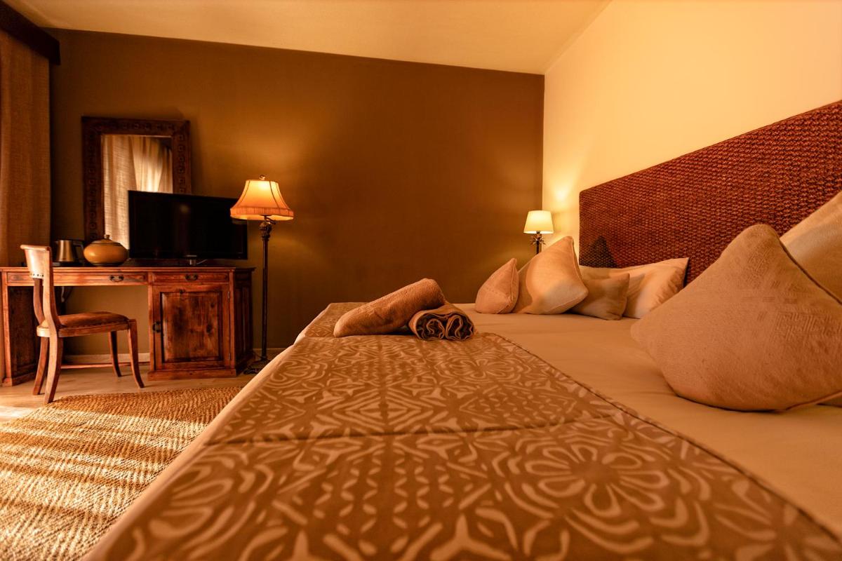 Cama o camas de una habitación en SWISS MORAIRA HOTEL & SPA - Adults only