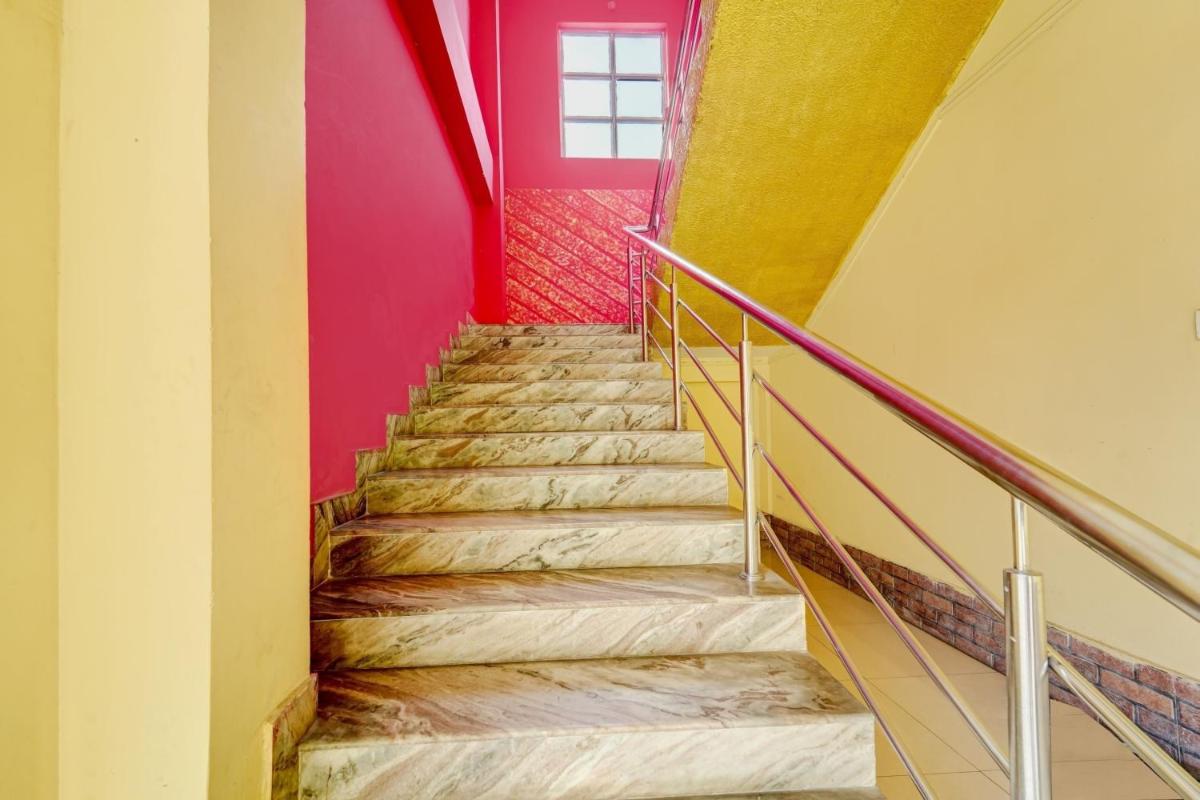 Hotel O Home Trimurti guest house - Housity