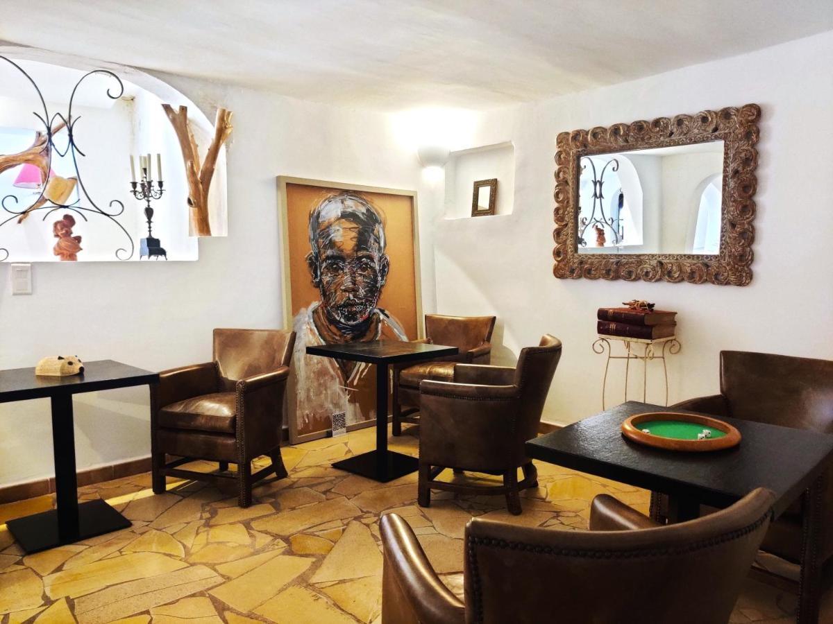 Coin salon dans l'établissement Le Roc E Fiori Hotel - Teritoria