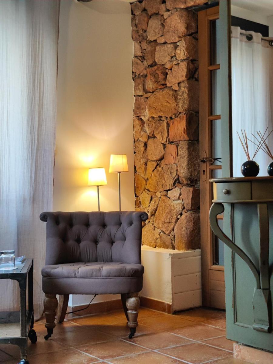 Coin salon dans l'établissement Le Roc E Fiori Hotel - Teritoria